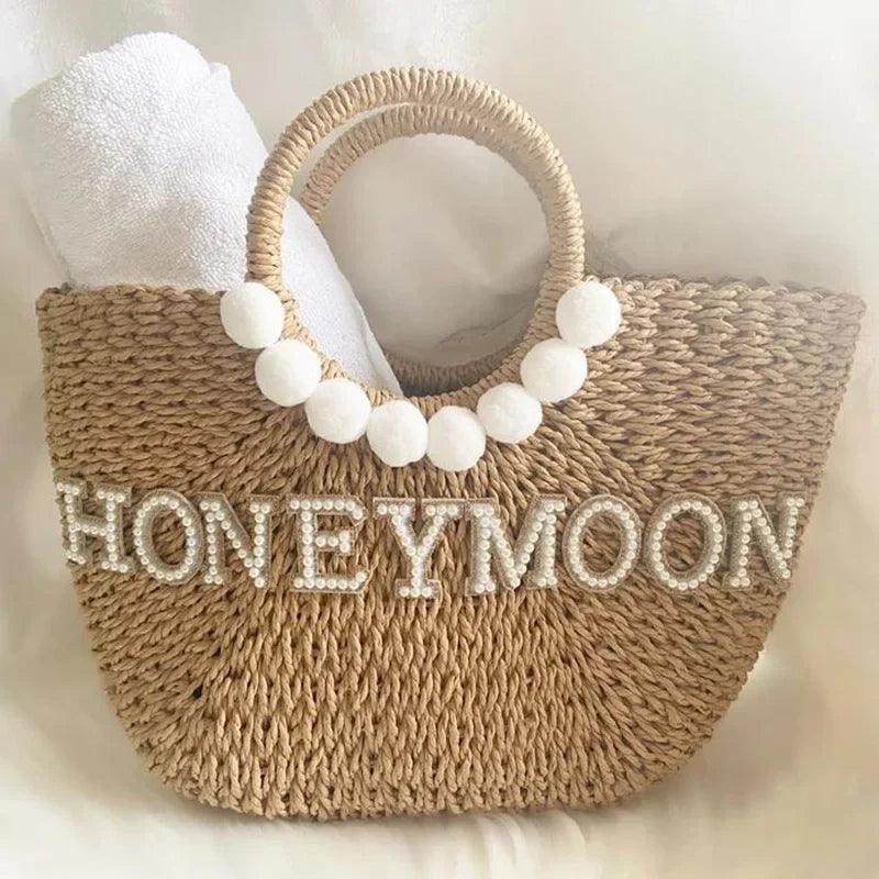 honeymoon pearl + pom straw bag - basil boutique