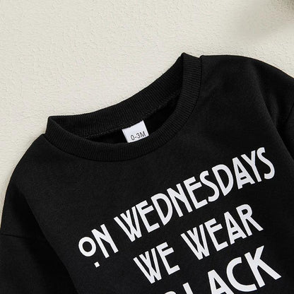 on wednesdays we wear black onesie - basil boutique