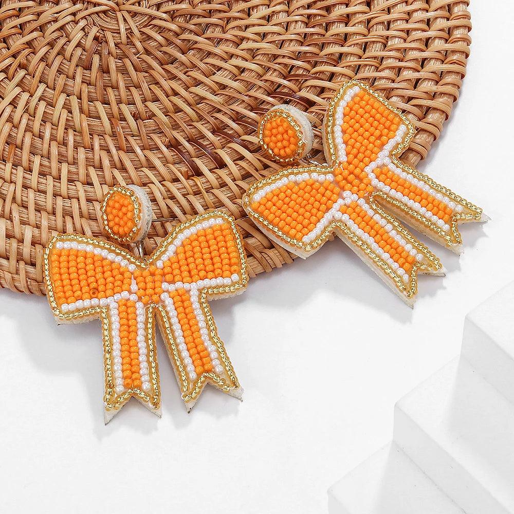 game day bow beaded earrings - basil boutique