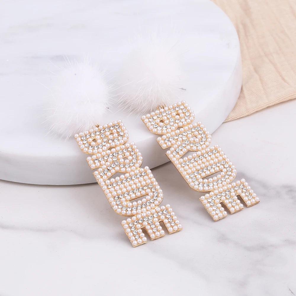 bride pom drop earrings - basil boutique