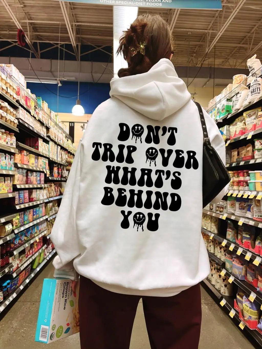 don't trip over what's behind you hoodie - basil boutique