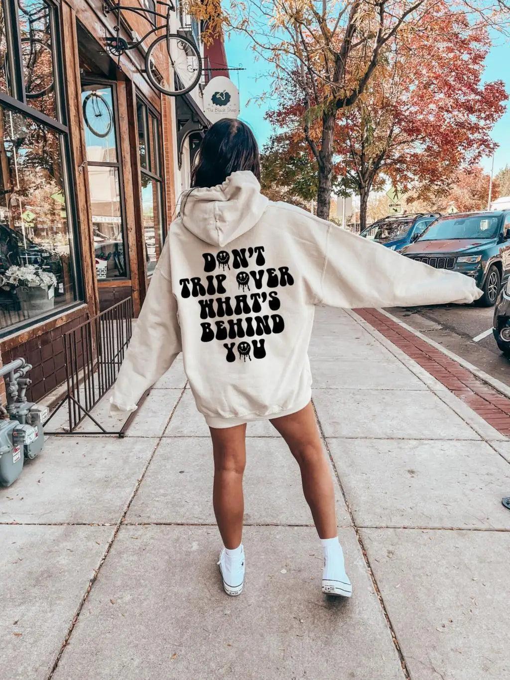 don't trip over what's behind you hoodie - basil boutique