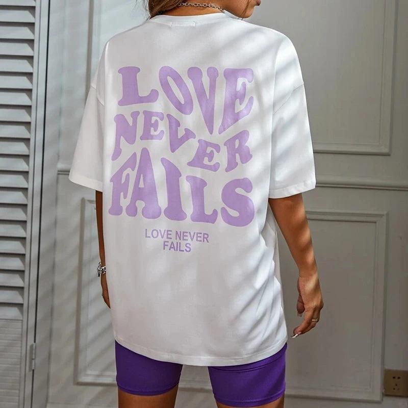 love never fails oversized t-shirt - basil boutique