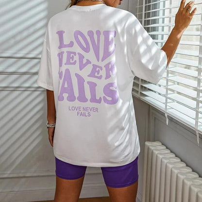 love never fails oversized t-shirt - basil boutique